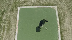 Man taking a swing in the golf park