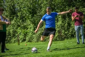 Man kicking a golf ball