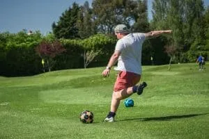 Guy kicking in footgolf