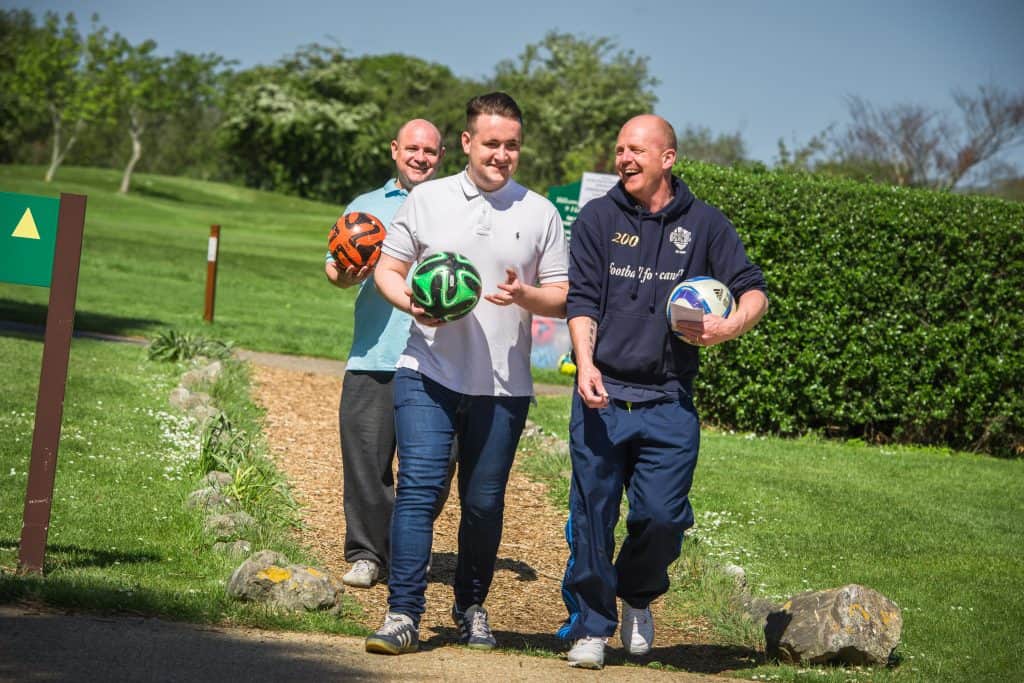 People arriving with footgolf balls