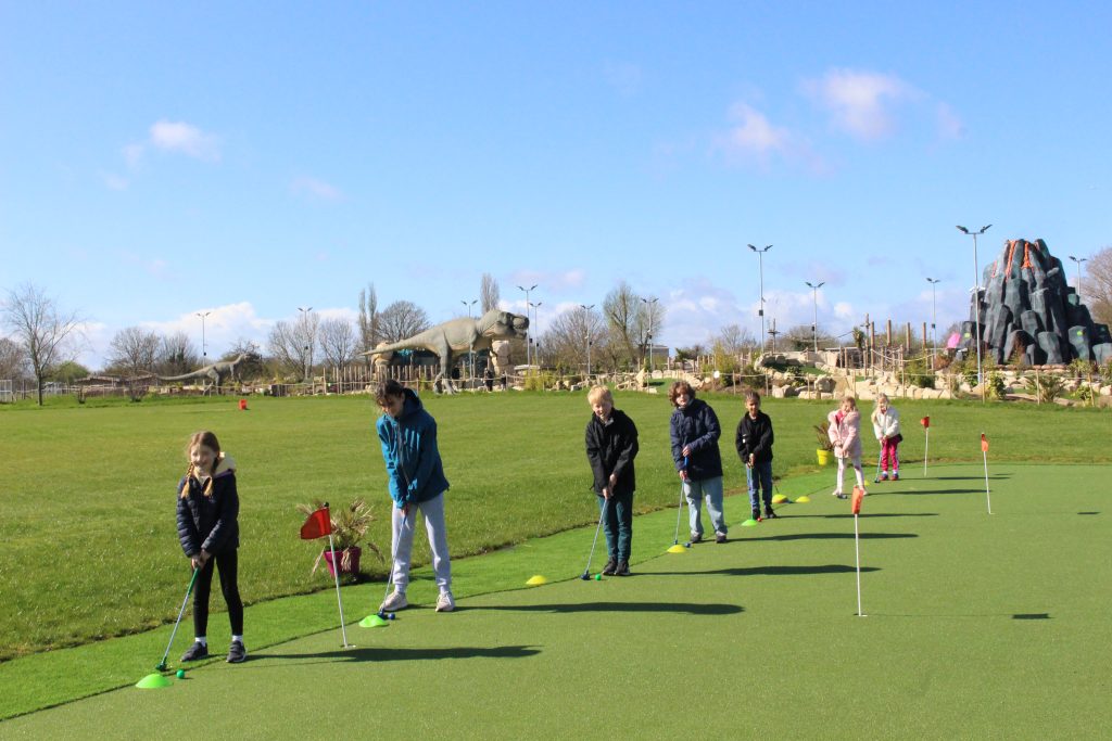 Kids having fun at the mini golf park