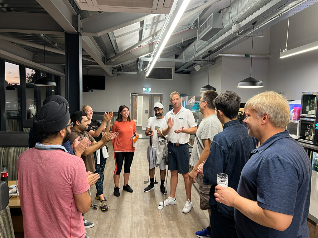 People Laughing and Clapping in Golf Park