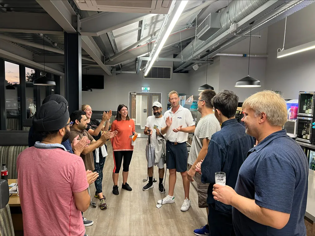 People Laughing and Clapping in Golf Park