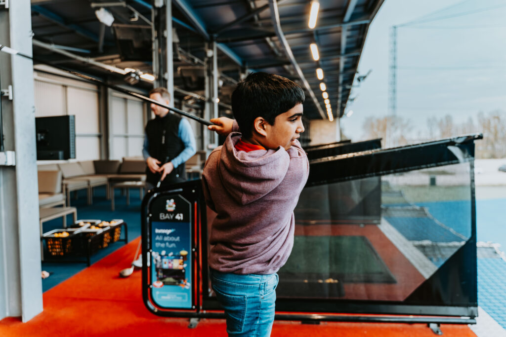 Kid Driving 2nd Floor of Good Time Golfin driving range